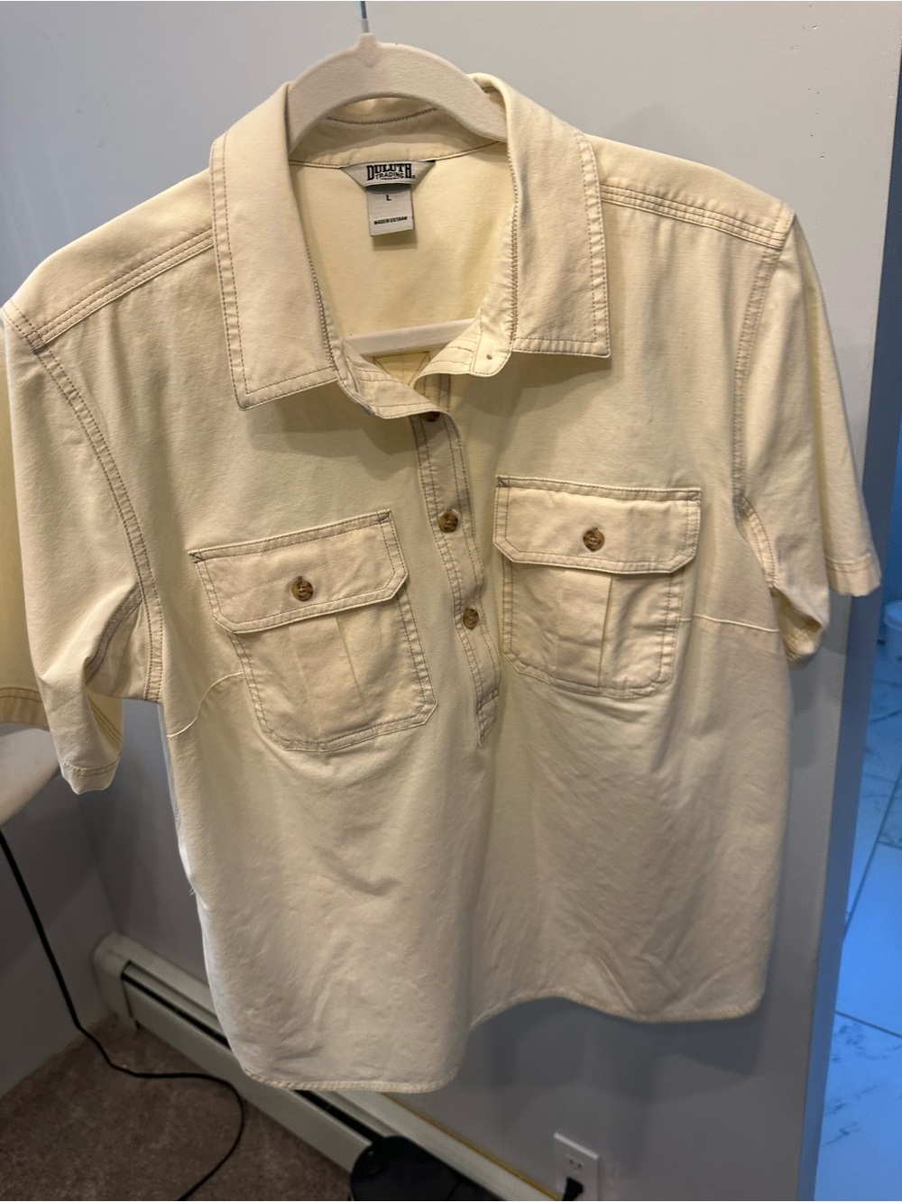 Duluth Trading Co women’s Short-Sleeve Pocket Polo in Cream